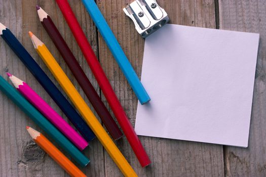 colorful crayons and peace of paper, mock up