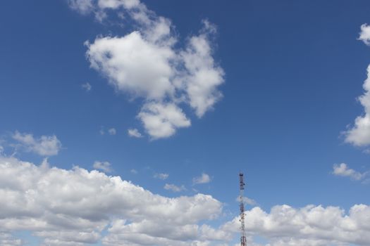 distant television tower on blue sky background