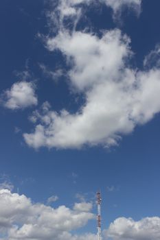 distant television tower on blue sky background