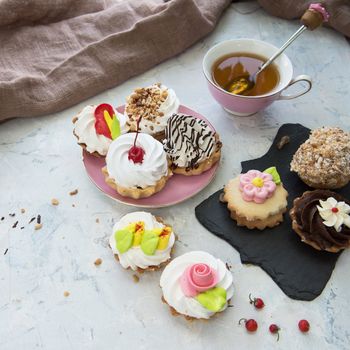 Different cakes composition on concrete background