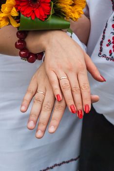 The hands of a newly-married couple after the wedding in Ukraine