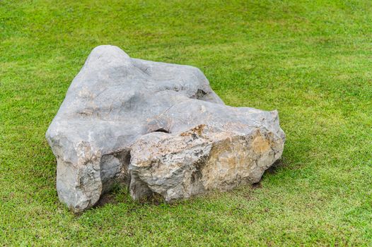 stone on green grass in the garden