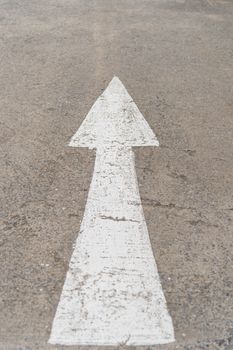 forward arrow sign on road texture