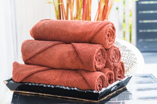 brown towels on wooden black tray