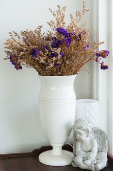 dried purple flower in vase