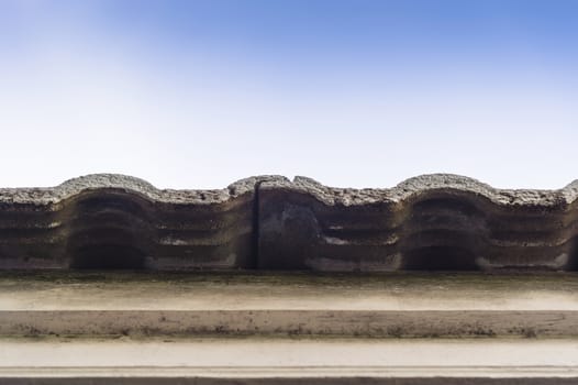 old roof tiles with blue sky