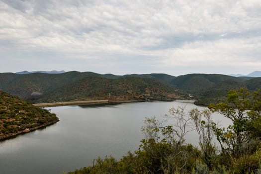 Cloudy and moody view from a bush of the dam at Calitzdorp.