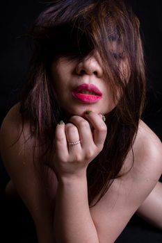 Nude Asian woman nude on black background