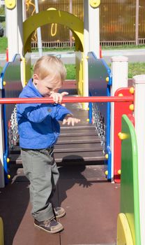 Boy in the Playground on Sunny summer day