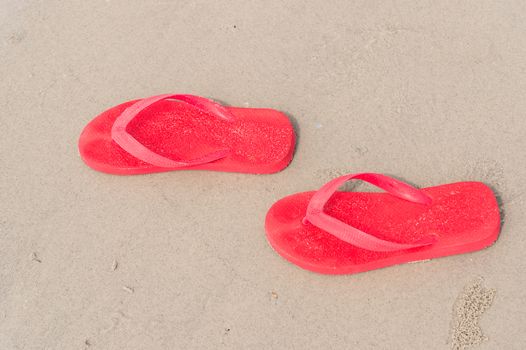 red sandals on beach
