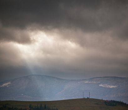 Overcast scene in cloudy mountains. November rain