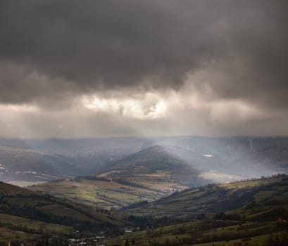 Overcast scene in cloudy mountains. November rain