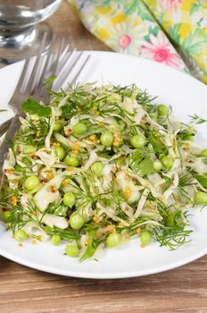 Coleslaw with cucumbers and peas, seasoned with dijon mustard and dill