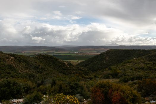 Beautiful South African landscape with farm land in the background, big cloud storm approaching