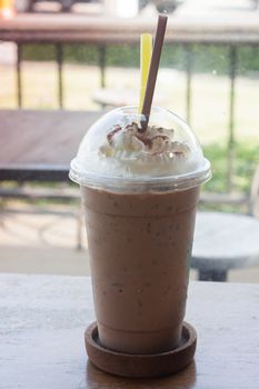 Iced coffee on wooden table, stock photo