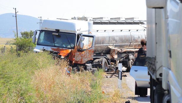Horizontal image of a tank transporter truck vehicle wreck.