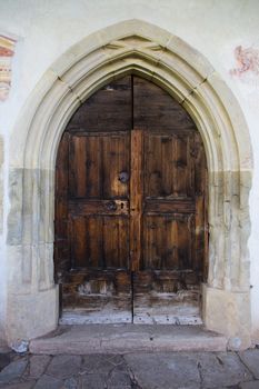 Front view of a wooden door of a church