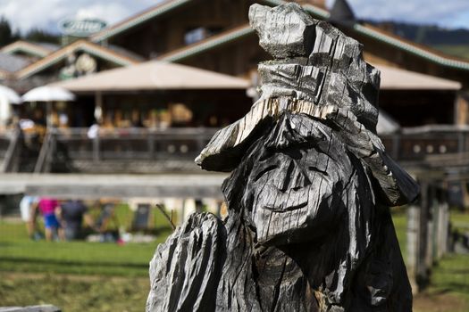 Close up view of a wooden statue of a witch