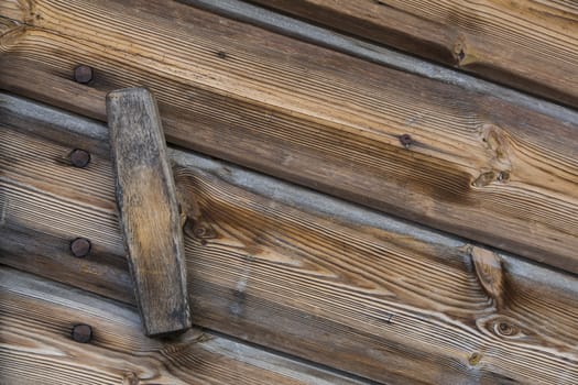 Close up view of a wooden handle of a door of a warehouse wood