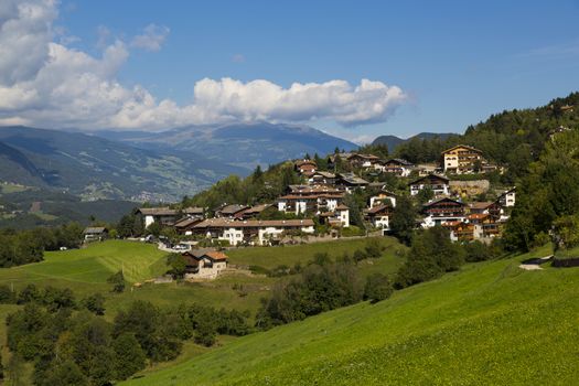 Panoramic view of the of Vols Am Schlern in a sunny day with clouds in the sky