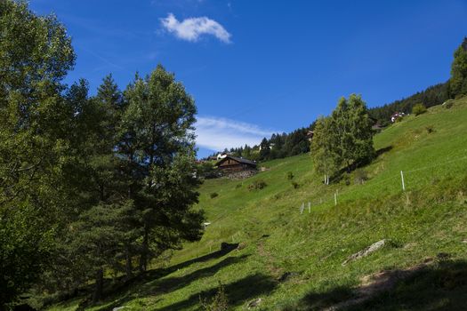 Distant view of a shelter in Seiser Alm on a sunny day