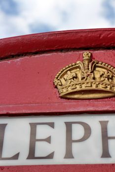 crown on a red telephone booth