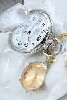 Few watches closeup under frozen water background