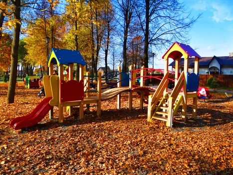 A bright picture of a playground in Autumn