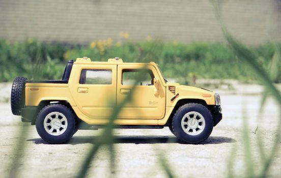 photo of Small toy pickup in the grass