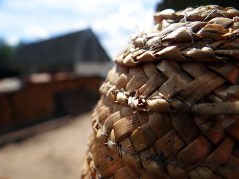 Photo of straw basket closeup on blurred background