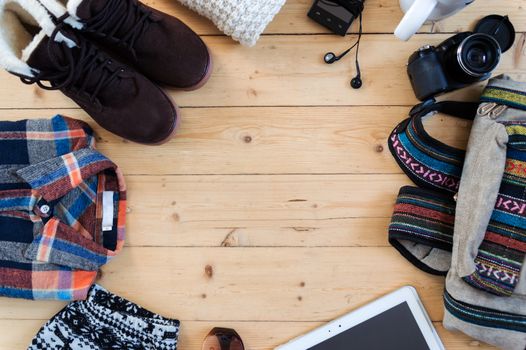 hipster clothes and accessories on a wooden background