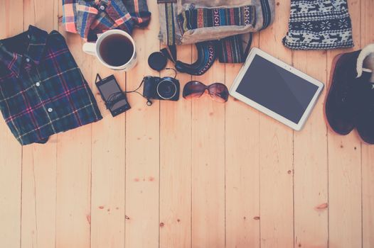 hipster clothes and accessories on a wooden background