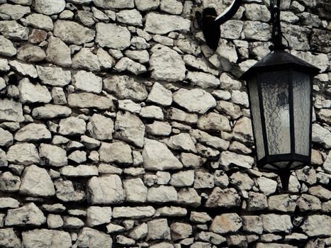 Old stone wall with lantern for Background concept