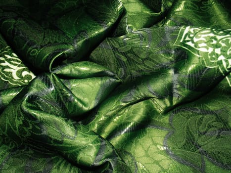Crumpled green cloth as texture and background