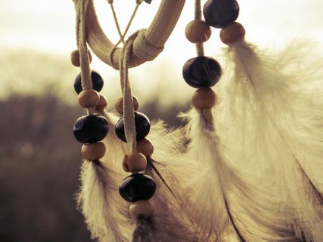 Wooden Dreamcatcher with feathers and beads - beautiful vintage photo