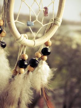 Wooden Dreamcatcher with feathers and beads - beautiful vintage photo