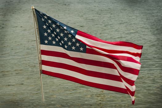 American flag with water on the background