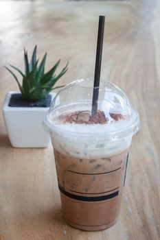 Iced coffee with green plant background, stock photo