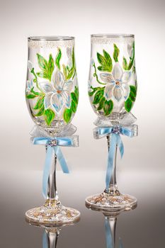 Wineglasses with painting on a glass studio background