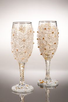 Wineglasses with painting on a glass studio background