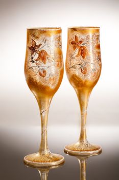 Wineglasses with painting on a glass studio background