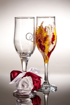 Wineglasses with painting on a glass studio background