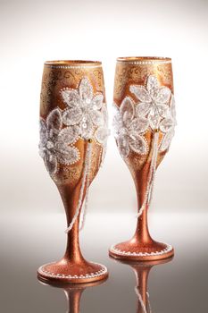 Wineglasses with painting on a glass studio background