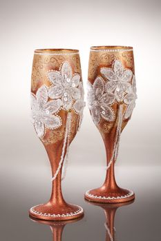 Wineglasses with painting on a glass studio background