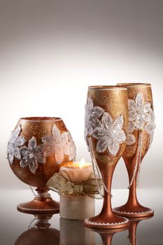 Wineglasses with painting on a glass studio background