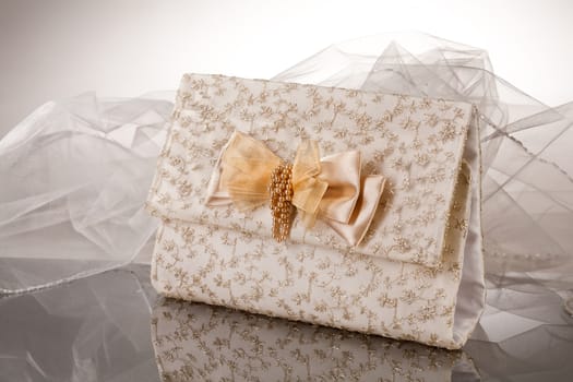 Fabric handmade bag for gift on a glass background
