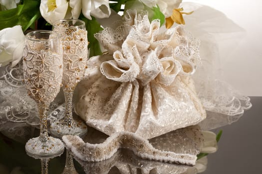 Fabric handmade bag for gift on a glass background
