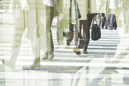 Multiple exposure image of businessman walking
