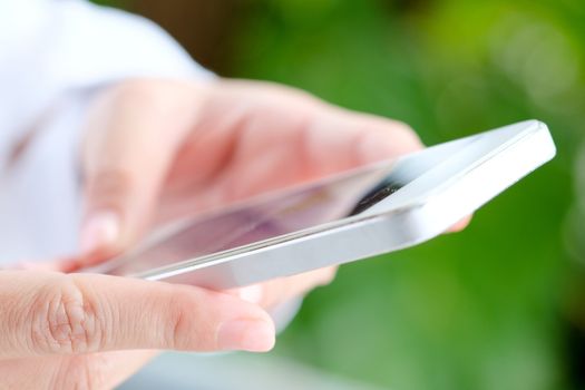 Image of Woman hand Using a Smart Phone background,communication
