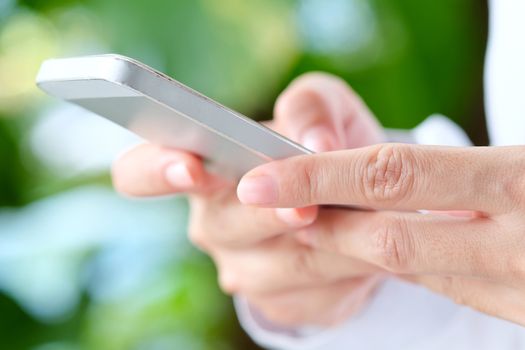 Image of Woman hand Using a Smart Phone background,communication